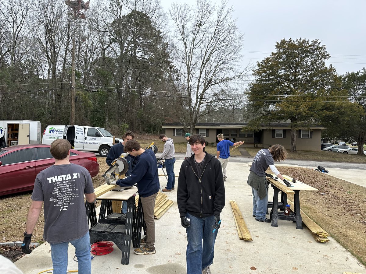 Brothers building at a Habitat for Humanity site